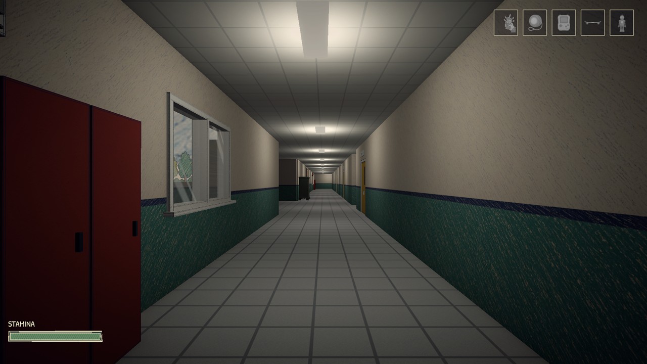 A long school corridor with cream walls, green paint and fluorescent lighting